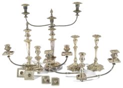 A selection of miscellaneous silver-plated candlesticks comprising of a pair with fluted stems and