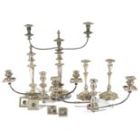 A selection of miscellaneous silver-plated candlesticks comprising of a pair with fluted stems and