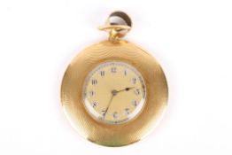 A slim 18ct gold open face engine turned pocket watch the case marked J. C. Vickery, the gilded dial