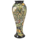 A Moorcroft pottery Shirewood slender baluster vase, by Philip Gibson, dated 2003 with tube lined
