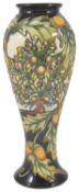 A Moorcroft pottery Shirewood slender baluster vase, by Philip Gibson, dated 2003 with tube lined