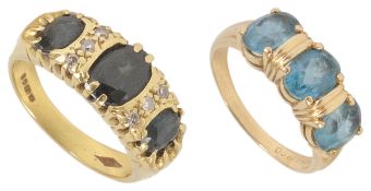 A sapphire and diamond set dress ring and another the three stone Australian dark sapphire set