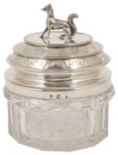 A silver plated and glass jar and cover, the cover with terrier shaped finial and engraved