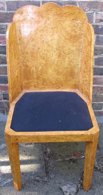 A suite of four Art Deco birds-eye maple dining chairs, with cloud burst canted backs above square