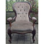 A Victorian mahogany button back upholstered armchair with scrolled front supports height: 92 cm,