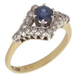 An attractive sapphire and diamond set fancy ring having central circular sapphire high mounted