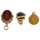 A Victorian gold mounted carnelian and bloodstone swivel fob with carved armorial, together with a