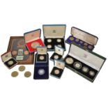 A collection of British Coinage to include a cased set of four £1 silver proof coins, a cased 25th