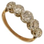 A five stone diamond set half hoop ring the stones in an illusion setting in an 18ct gold and