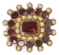 A Georgian garnet and seed pearl brooch with central rectangular flat cut garnet set within a