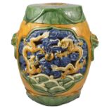 A Oriental pottery polychrome painted garden seat, 20th century of cylindrical form with incised and