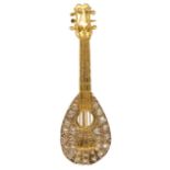 An amusing contemporary rose diamond and gold brooch in the form of a mandolin the body of the