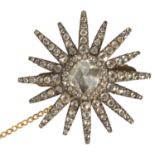 An attractive late 18th century large rose Dutch cut diamond set star brooch the centre stone