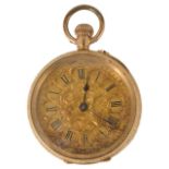 A 14K gold Ladies open cased pocket watch with gilt foliate engraved dial with Roman numeral