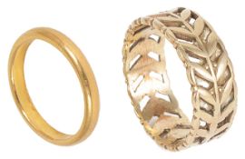 A narrow 22ct gold plain wedding band and another 9ct gold pierced, foliate wedding band, both fully