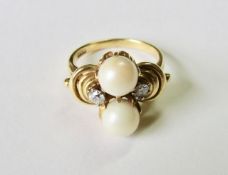 A two stone diamond and pearl fancy ring of unusual design the 18ct gold mount set with twin