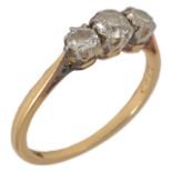 A small three stone diamond set ring, centre stone approx. 0.20ct flanked by two smaller diamonds of