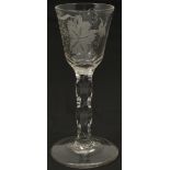 Three 18th century Cordial glasses comprising of a pair with etched bowls decorated with flowers