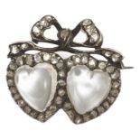 A charming 19th Century twin moonstone heart and rose diamond love brooch with central heart