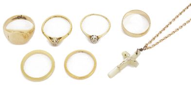 A small collection of gold rings and other items to include an 18ct gold band, another, tests