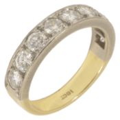 A nine stone diamond set half eternity ring 18ct yellow and white gold mount, the stones of even