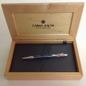 A Caran d'Ache ballpoint pen, with blue enamel hexagonal body in presentation pine case. length: