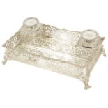 A Victorian silver desk stand, London 1891 of rectangular form with ribbed foliate pierced grille