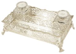 A Victorian silver desk stand, London 1891 of rectangular form with ribbed foliate pierced grille