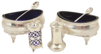A pair of George III silver oval shaped salts, London 1806 with gadrooned borders above foliate