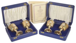 Two cased sets of Toye Kenning and Spencer silver Churchill centenary goblets all with relieve image