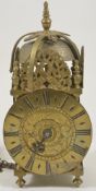 A miniature brass lantern alarm time piece the 4-inch dial signed John Hatton London, with a