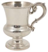 A Victorian silver tankard, Sheffield 1894 of flared bulbous form with s-scroll handle, raised