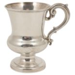 A Victorian silver tankard, Sheffield 1894 of flared bulbous form with s-scroll handle, raised