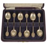 A cased set of golfing coffee spoons each spoon hallmarked Sheffield 1945, each with finial engraved