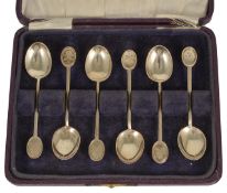 A cased set of golfing coffee spoons each spoon hallmarked Sheffield 1945, each with finial engraved