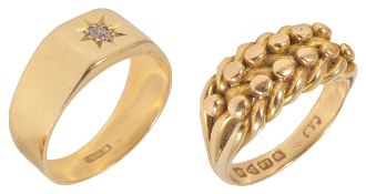 Two Edwardian gentlemen's 18ct gold dress rings one with a small central diamond in star cut