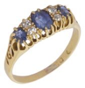 A Victorian sapphire and diamond set gypsy ring the central stone with twin diamonds to either