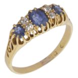 A Victorian sapphire and diamond set gypsy ring the central stone with twin diamonds to either