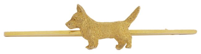 An amusing 9ct gold 'Scottie' dog brooch the Scottie naturalistically modelled and with his tail up,