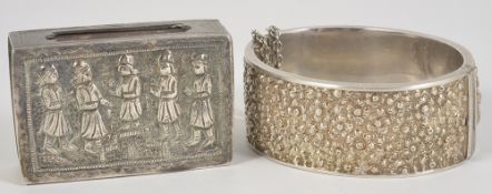 An early 20th century Indian white metal bangle and a similar match box holder the hinged bangle,