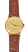 An Omega 14K gold gentleman's wristwatch the circular champagne coloured dial with baton hours