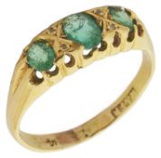 A late Victorian emerald and diamond set gypsy ring having three emeralds with diamond point detail,