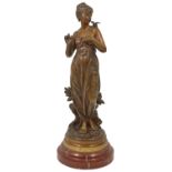 Eutrope Bouret (French 1833 - 1906) a bronze maiden with a bird resting upon her left shoulder,