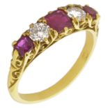 An 18ct gold mounted ruby and diamond five stone ring set with a central square cut ruby flanked