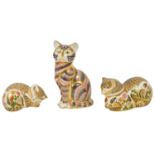 A group of three Royal Crown Derby paperweights in the form of cats and kittens the first modelled