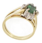 An unusual late 20th century emerald and diamond reversible cluster ring converting to a star shaped