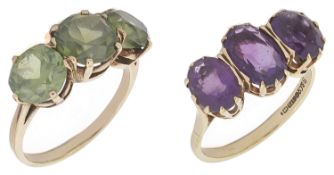 A large contemporary green tourmaline set fancy ring and an amethyst fancy ring the three stone