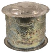 A large silver plate lidded cake tin, 20th century of cylindrical form embossed with swags of