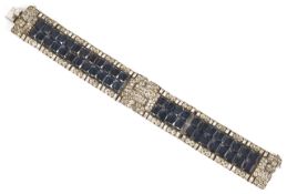 A Continental Art Deco silver and sapphire paste dress bracelet fully articulated and set with