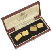 A pair of early 20th century 18ct gold cufflinksof cut cornered rectangular design and with